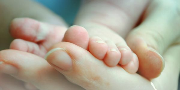 holding baby hands, baby blessing