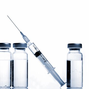 Syringe with vials of drugs.