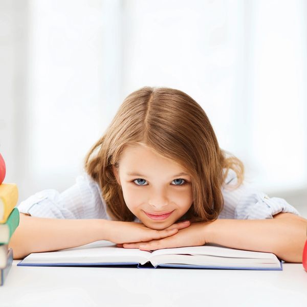 smiling girl doing homework