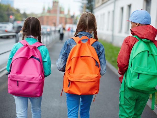 children walking with back packs