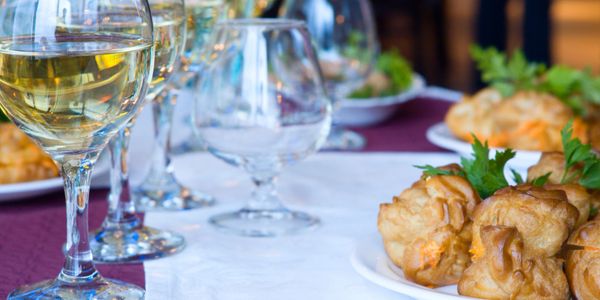 Elegant wine glasses set up for a catered event