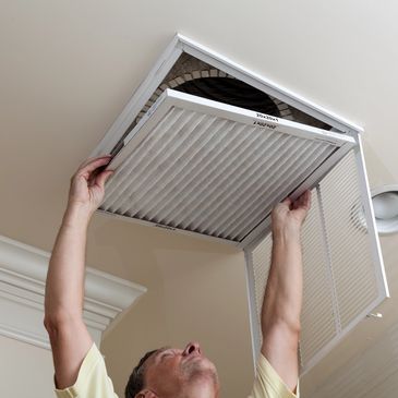Handy person replacing air filter