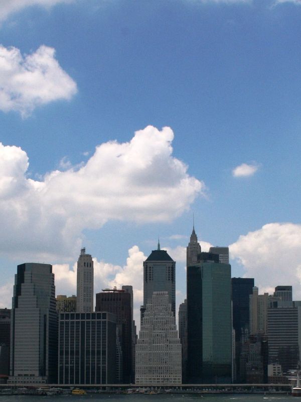 Vertical picture of a high-rise landscape with a party clear sky.