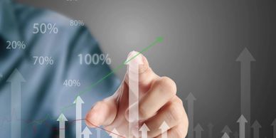 Man pointing to a data point on a graph