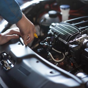 Mechanic checking out engine