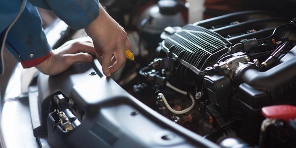 Mechanic fixing car engine