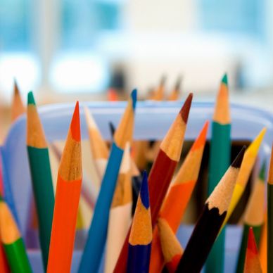 Close-up of colorful sharpened pencils in a container.