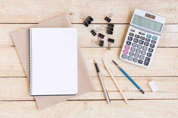 office accessories | notebook, pencils and calculator | CS Tax Experts