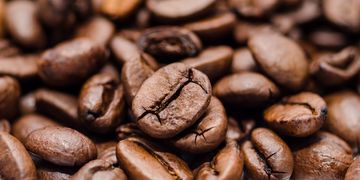 Close-up of roasted coffee beans with detailed textures.
