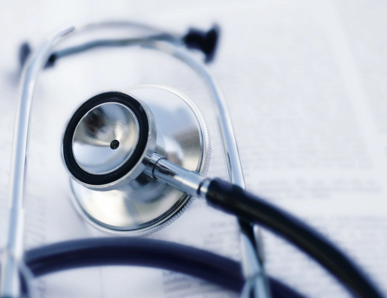 Close-up of a stethoscope on a medical document.