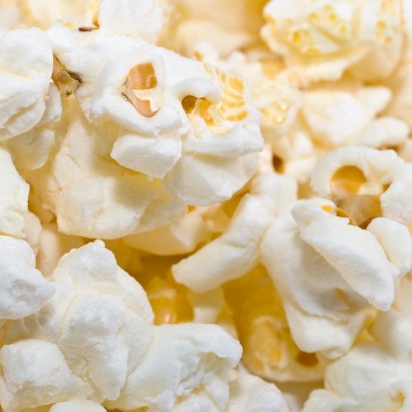 Close-up of freshly popped white popcorn kernels.