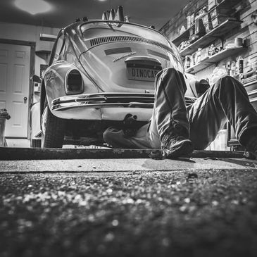 Technician working on a VW Beetle