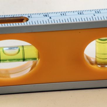 Close-up of a spirit level with measurement markings.