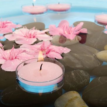 flowers in water and candles 