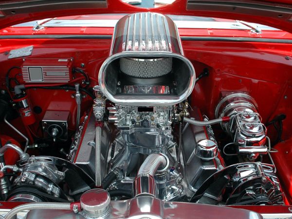 Polished small block chevy engine with tunnel ram intake and dual carburetors