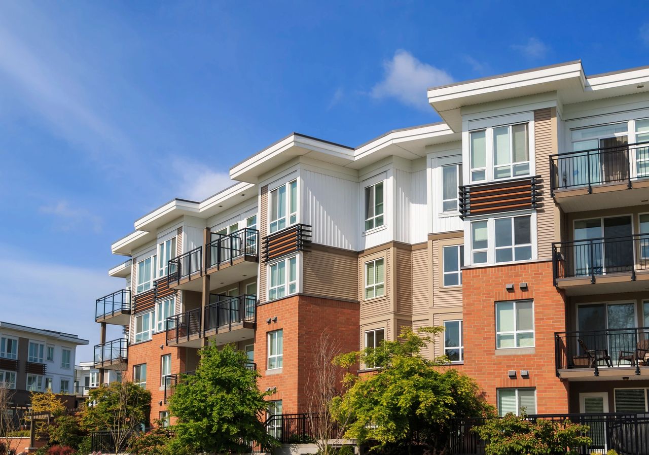 An red, tan and white apartment complex.