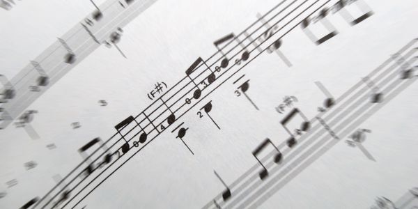Close-up of musical notes on sheet music.