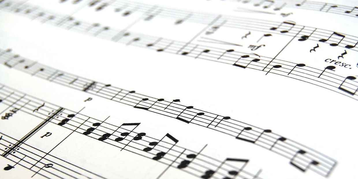 Close-up of musical notes on sheet music.