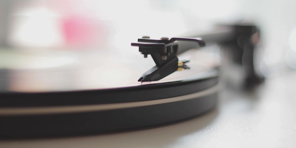 Close-up of a record player's needle on a vinyl disc.