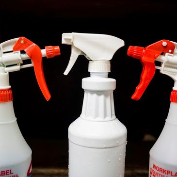 Three spray bottles adverting protection barrier sprays for Carpets, Rugs and Upholstery Items.