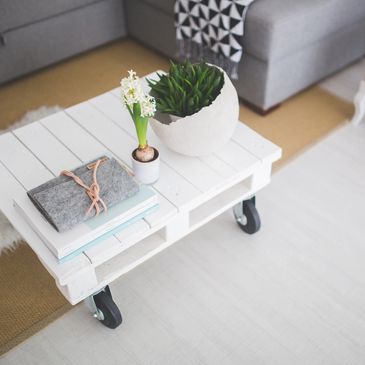White coffee table with decorations in living room