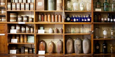 wall of shelves containing many different types of bottles 