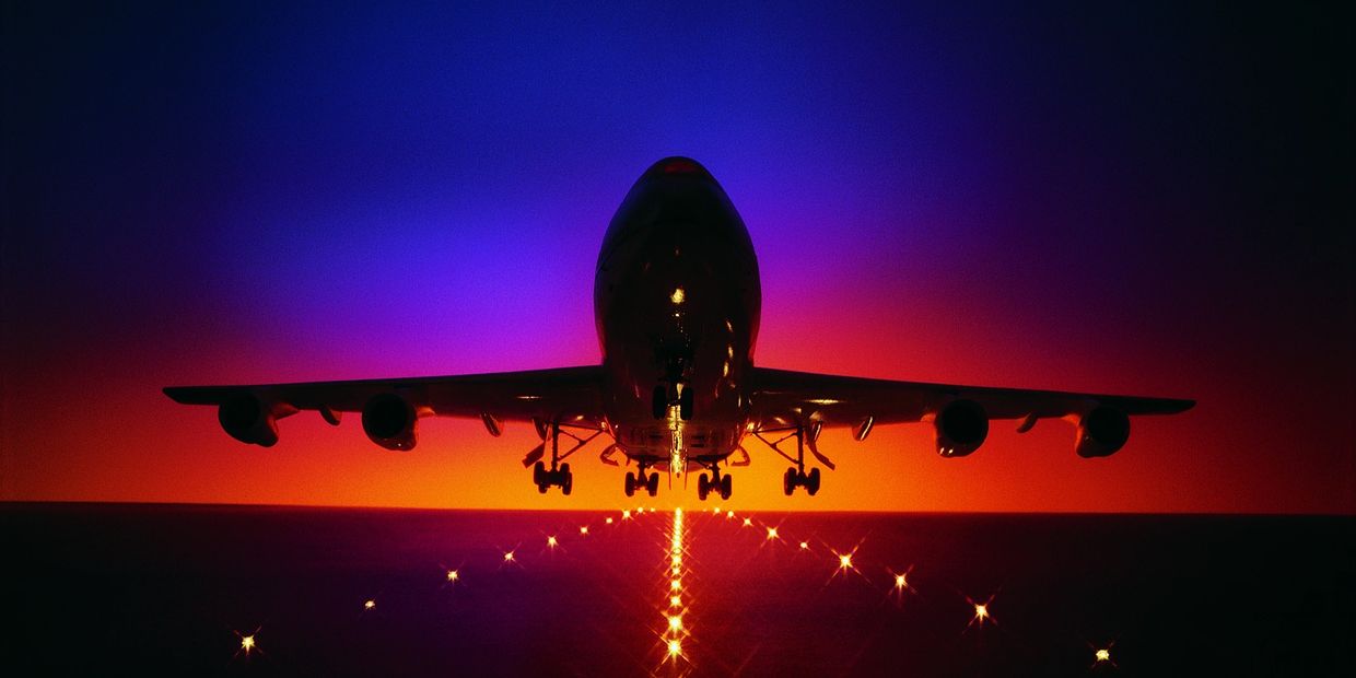 closeup of commercial airplane taking off from the runway