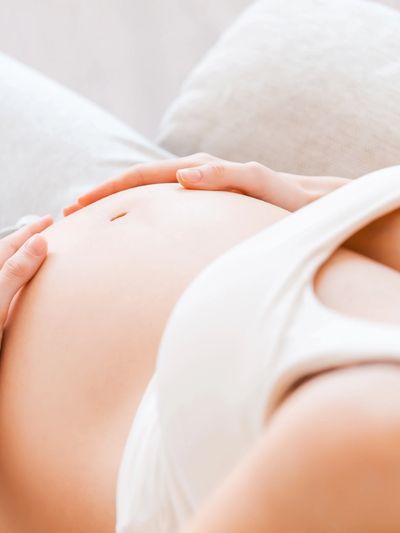 Person receiving emotional support during infertility or postpartum therapy in Denver
