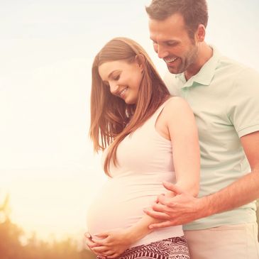 A young couple happily anticipate the arrival of their baby