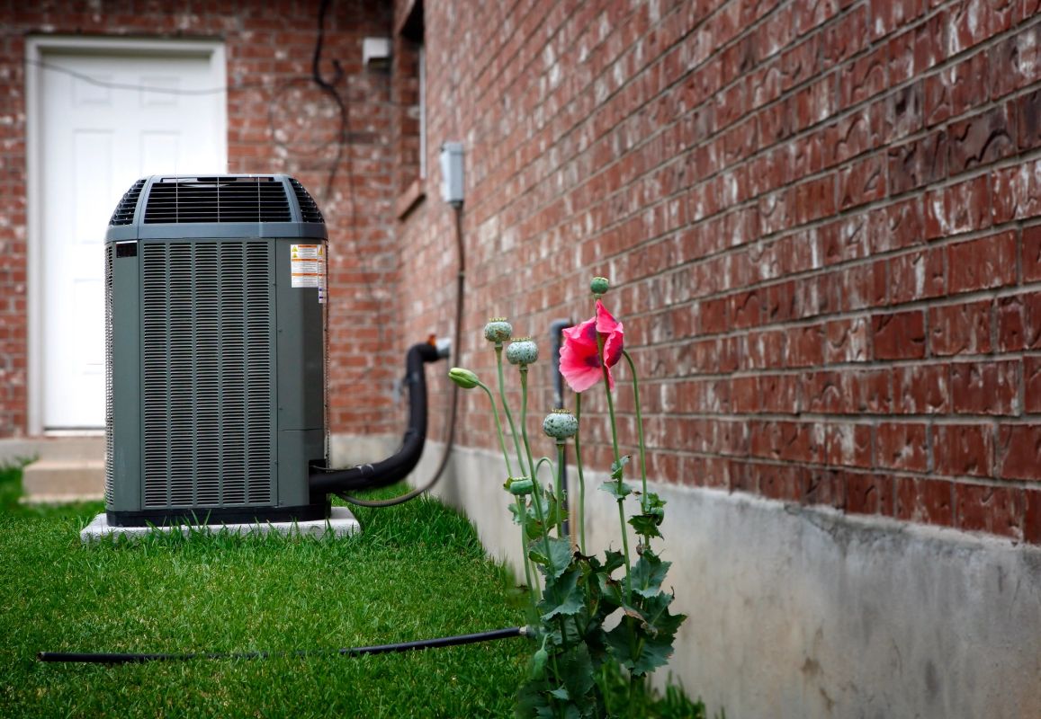 Cowboy Air technician repairing a residential heating system and furnace in Dallas-Fort Worth