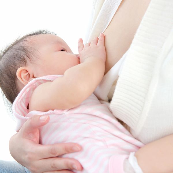 A baby being breastfed.