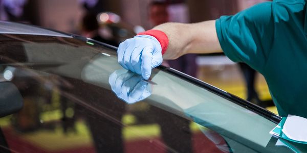 Windshield chip repair worker