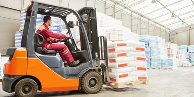 Forklift operating in a warehouse
