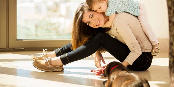 This is a French speaking, bilingual nanny playing with a 3-year-old girl and her puppy. 