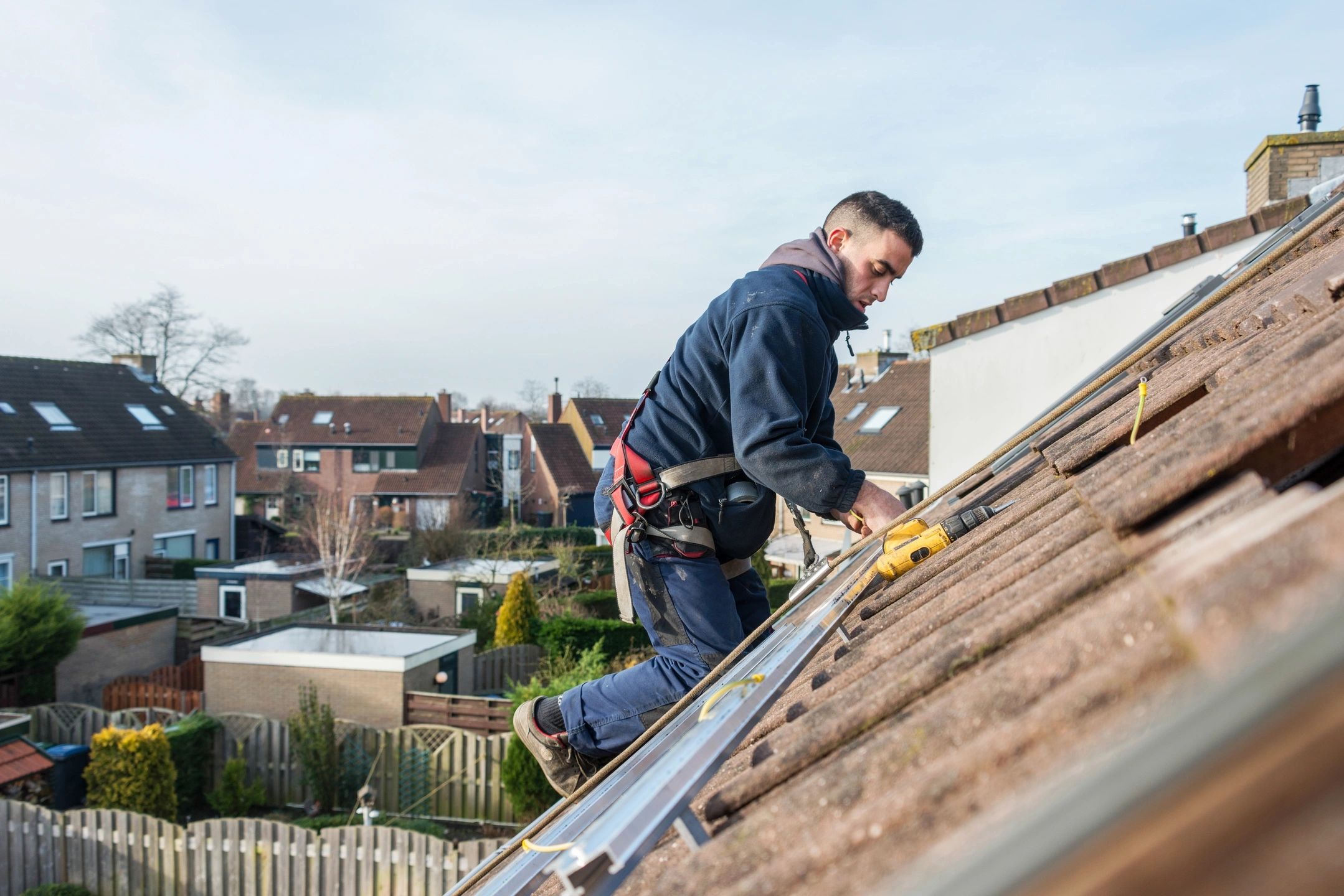 Roofing restoration contractor on home roof in mornington peninsula