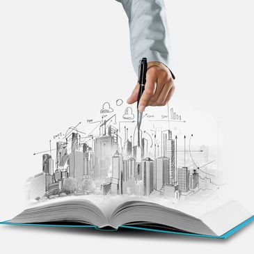 Hand drawing a cityscape emerging from an open book with business charts and icons.