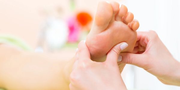Person receiving a foot massage.