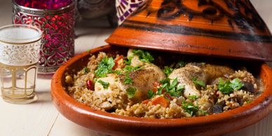 Traditional Moroccan tagine with chicken and couscous.
