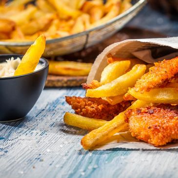 Crispy fish and chips served with creamy tartar sauce.