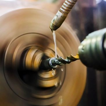 Using the lathe to drill a hole in round stock