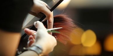 A woman crafting the hair in detailed manner