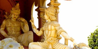 Intricate statue of a mythological figure in a dynamic pose, showcasing detailed craftsmanship.