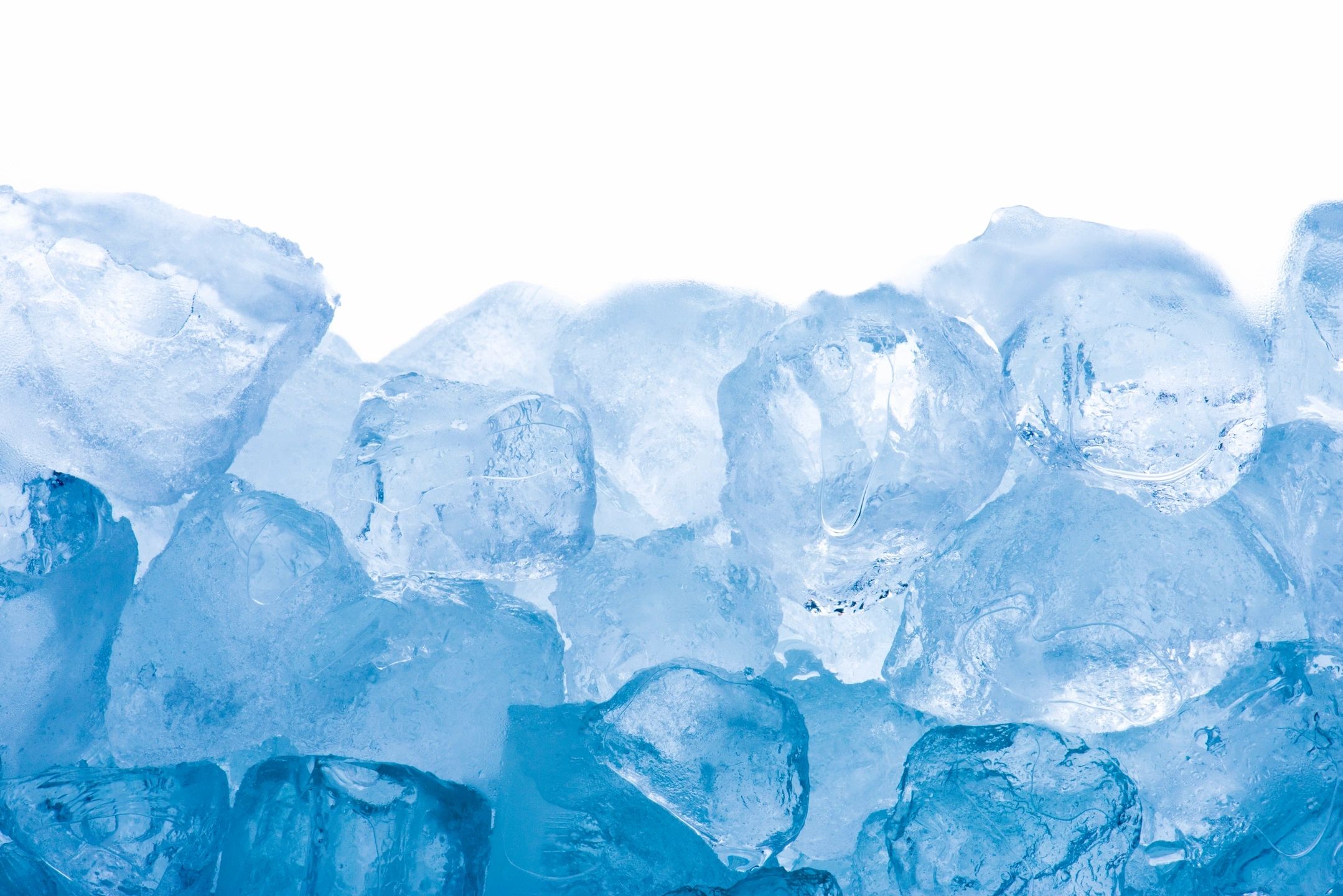 Close-up of translucent blue ice cubes with a white background.