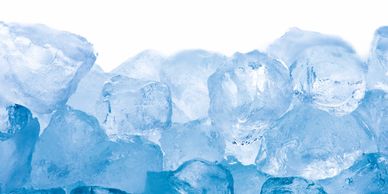 Close-up of translucent blue ice cubes stacked together.