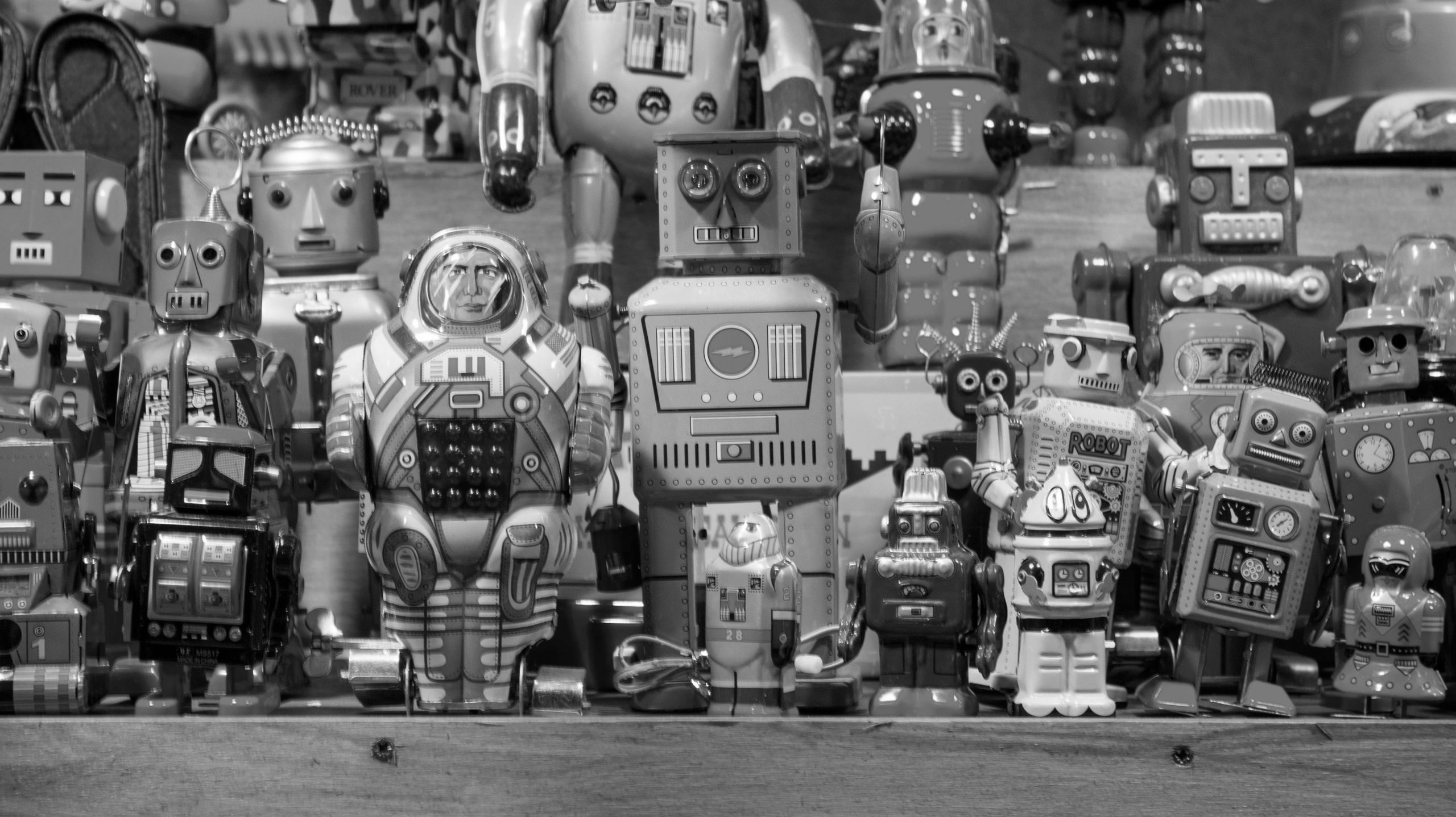 photo of many different shapes and sizes of toy robots