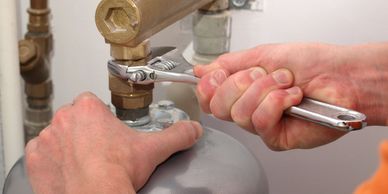 Boilers and water heaters
hands fixing water heater with wrench