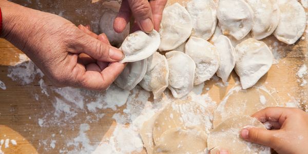 Making dumplings (jiaozi)