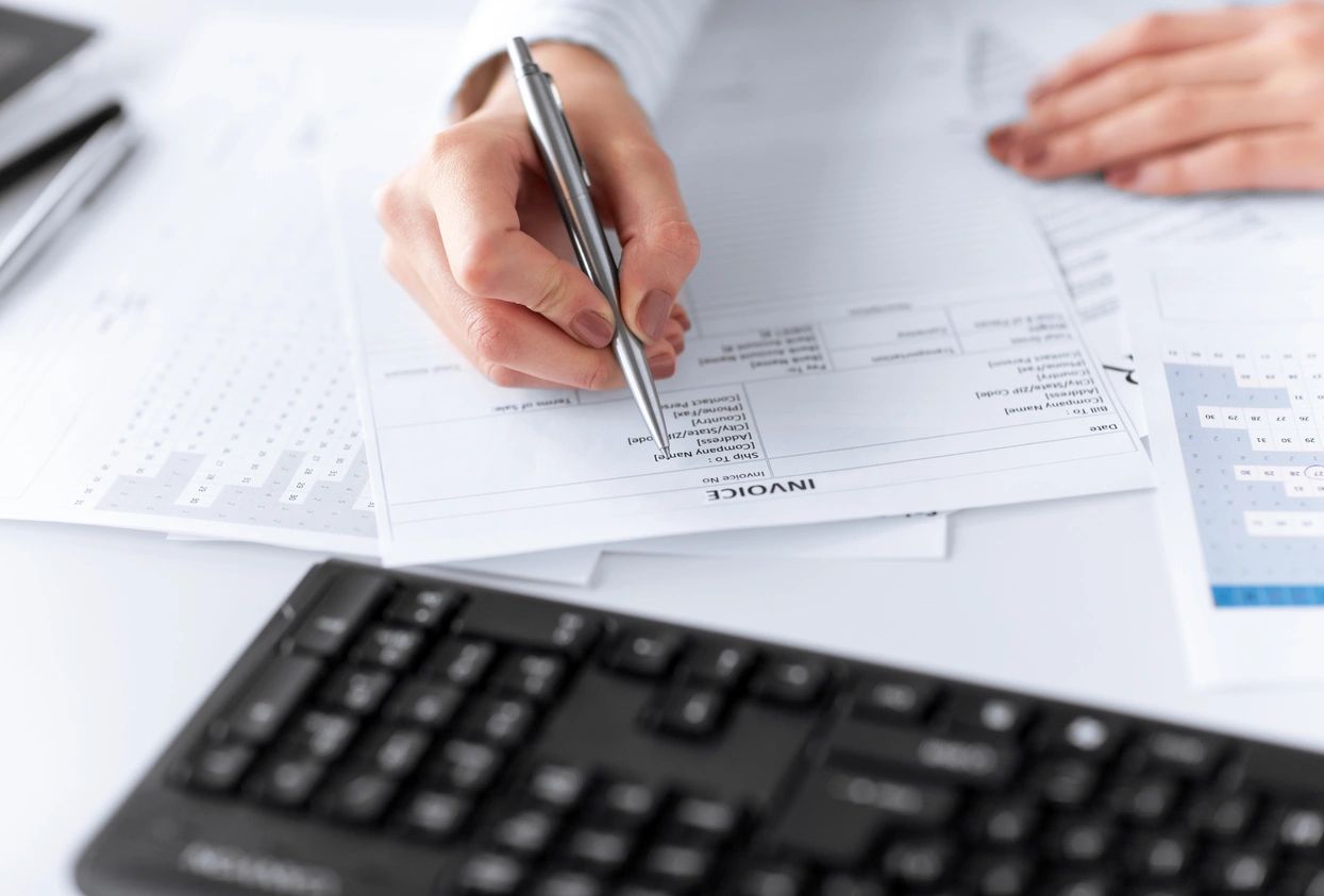 Business owner analyzing accounting documents