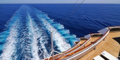 View of the ocean and ship's wake from a cruise ship deck.