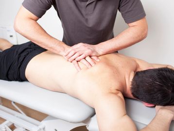 A Chiropractor performing an adjustment.